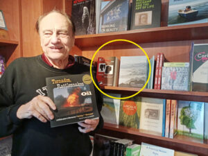 Thomas Cochrane with all 3 of the books he's authored at Four-Eyed Frog Books in Gualala, CA
